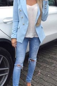 Female Stand Along the Car Wearing Jeans and Blazer